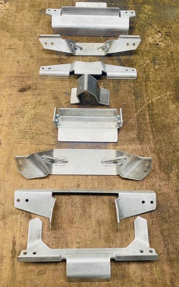 a selection of brackets and small parts in mild steel